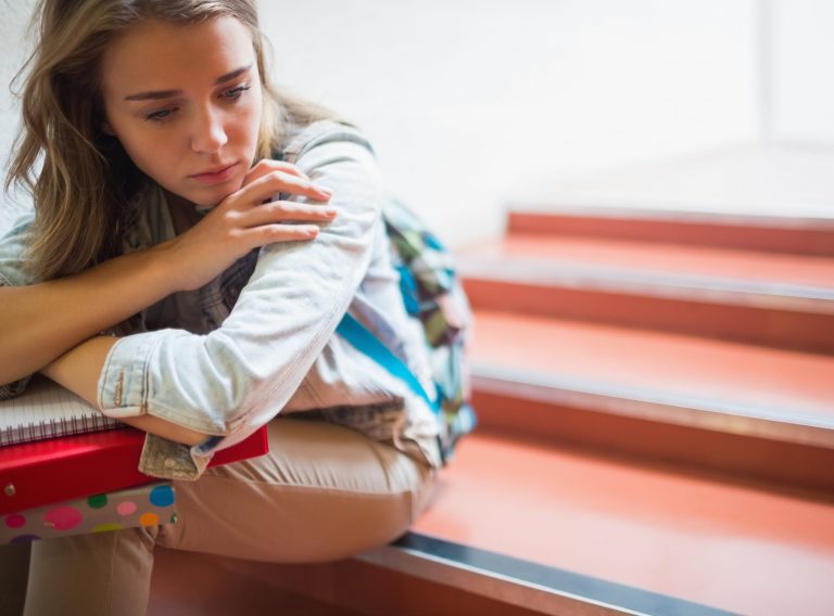 Sad,Lonely,Student,Sitting,On,Stairs,In,College