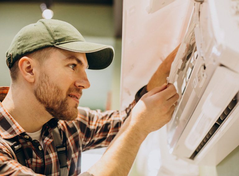 Repairman doing air conditioner servise